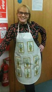 Sharon kitchen duties at church rehab recovery cafe